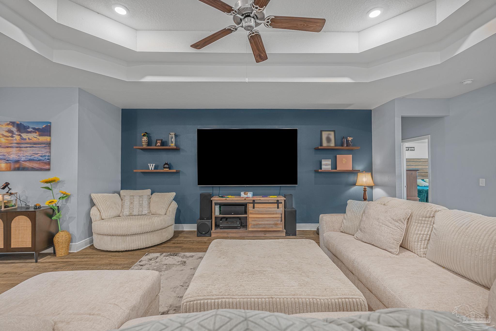 355 Cayden Way Cantonment, FL 32533 - Photo 20 of 61 a living room with furniture and a flat screen tv