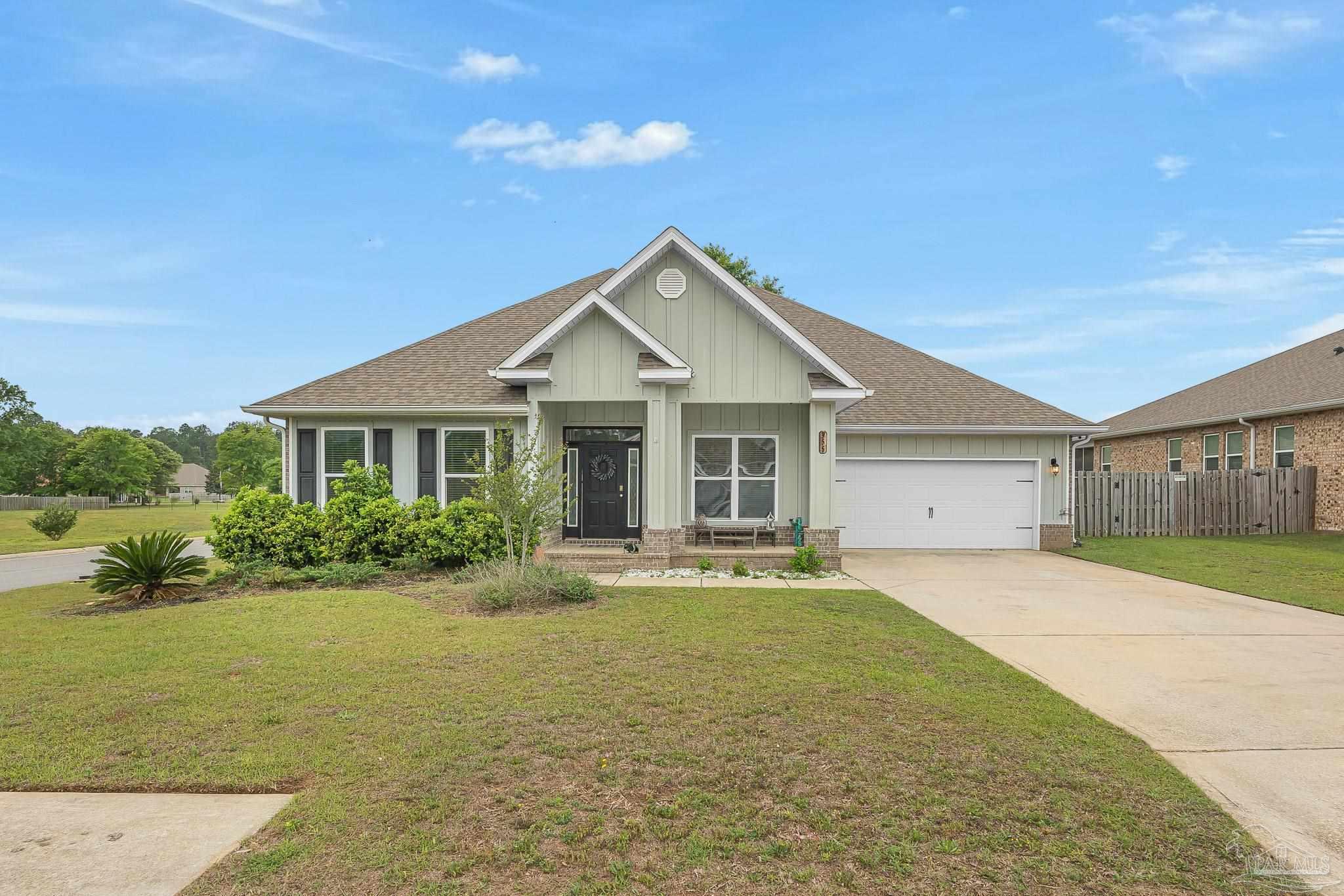 355 Cayden Way Cantonment, FL 32533 - Photo 2 of 61 a front view of house with yard and green space