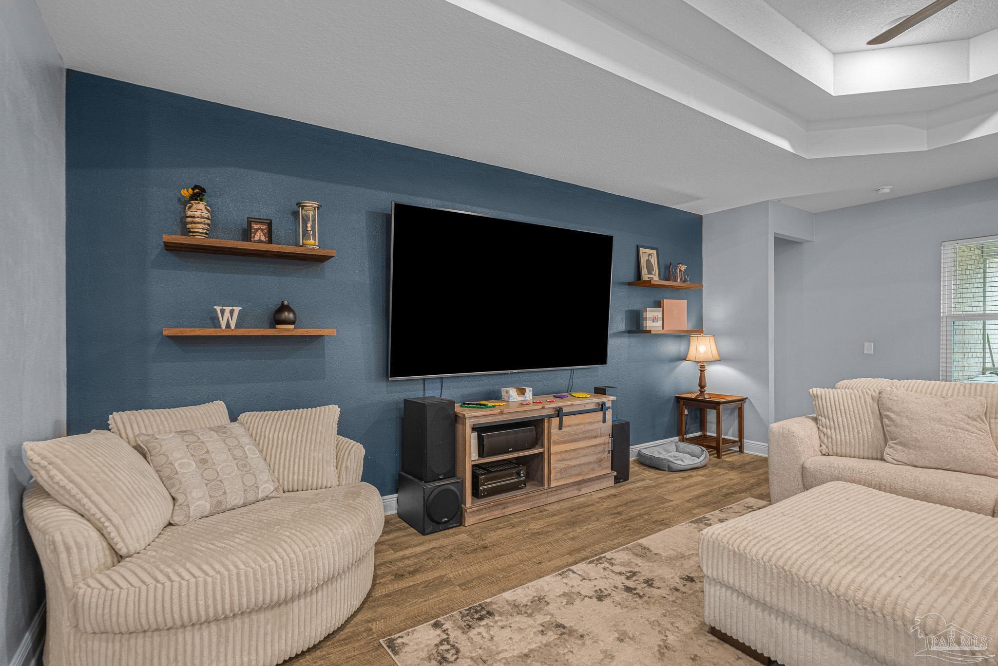 355 Cayden Way Cantonment, FL 32533 - Photo 23 of 61 a living room with furniture and a flat screen tv