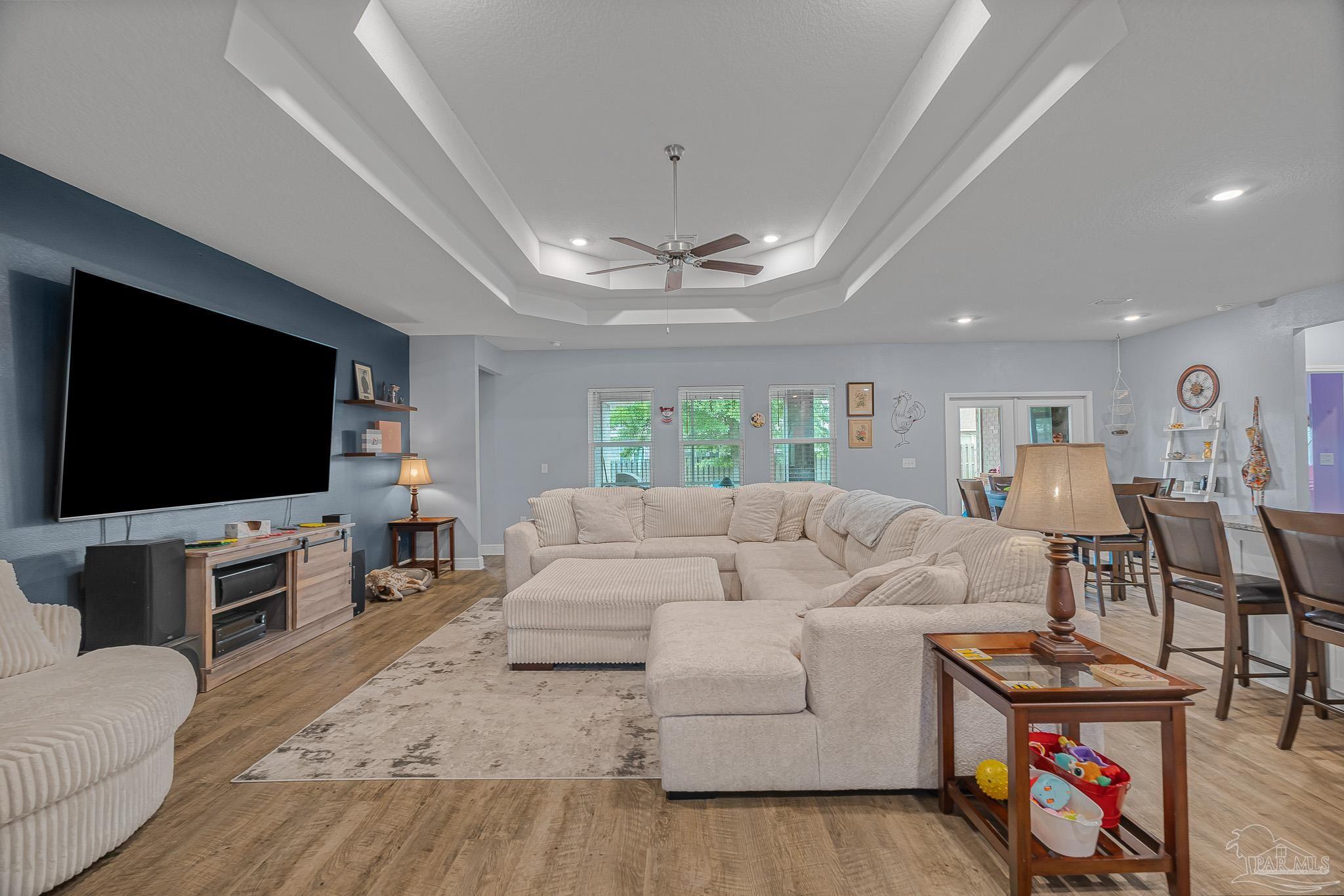 355 Cayden Way Cantonment, FL 32533 - Photo 24 of 61 a living room with furniture and a flat screen tv