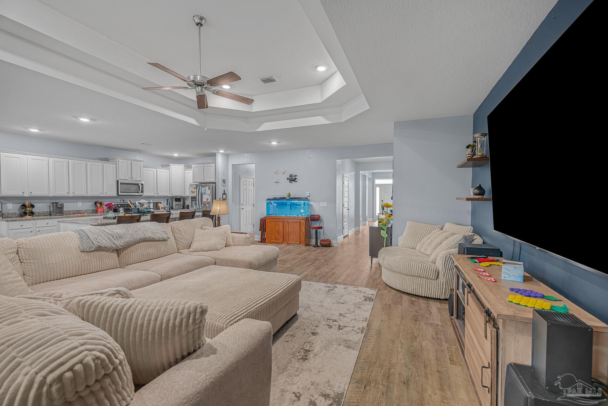 355 Cayden Way Cantonment, FL 32533 - Photo 25 of 61 a living room with furniture and kitchen view