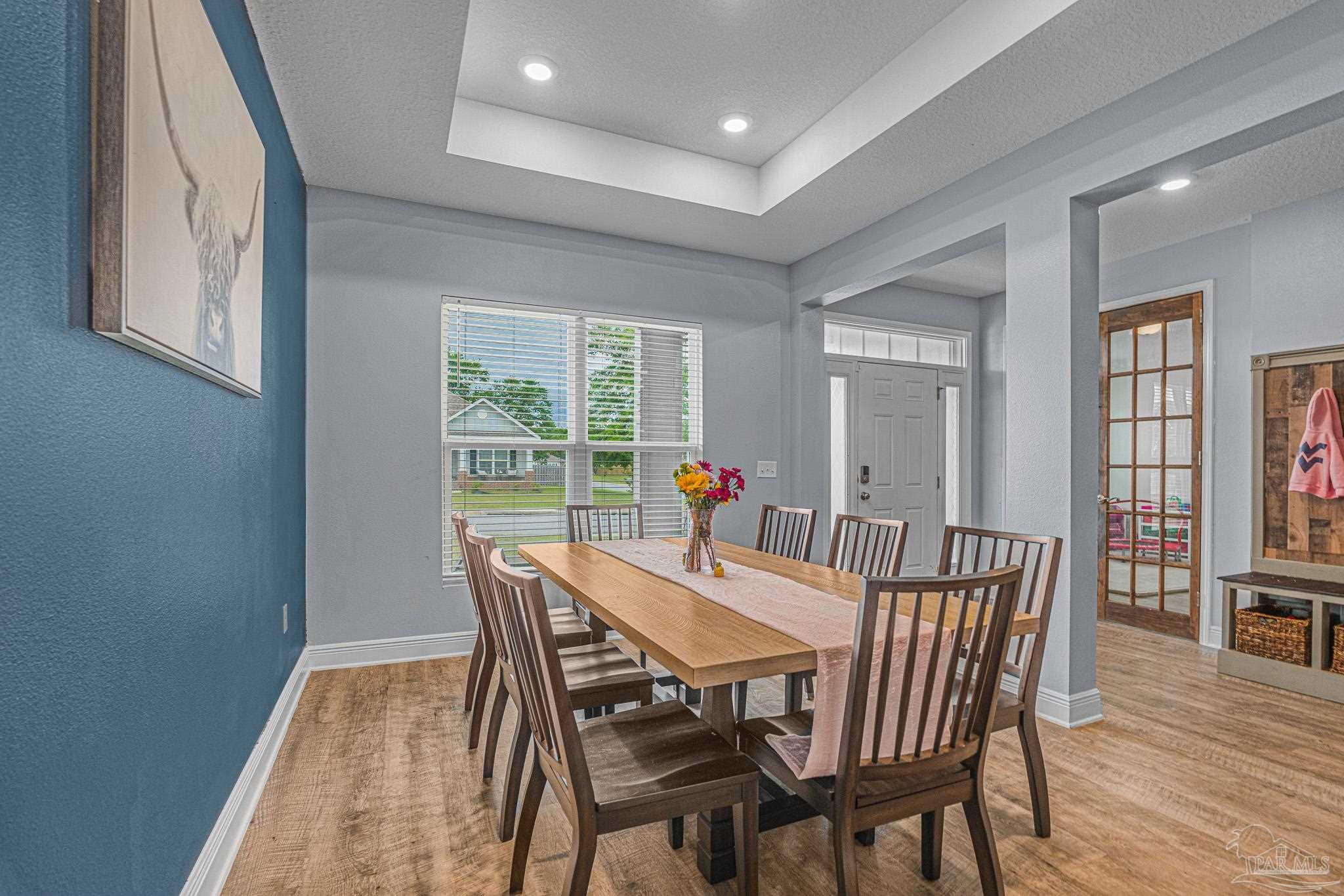 355 Cayden Way Cantonment, FL 32533 - Photo 27 of 61 a view of a dining room with furniture and wooden floor