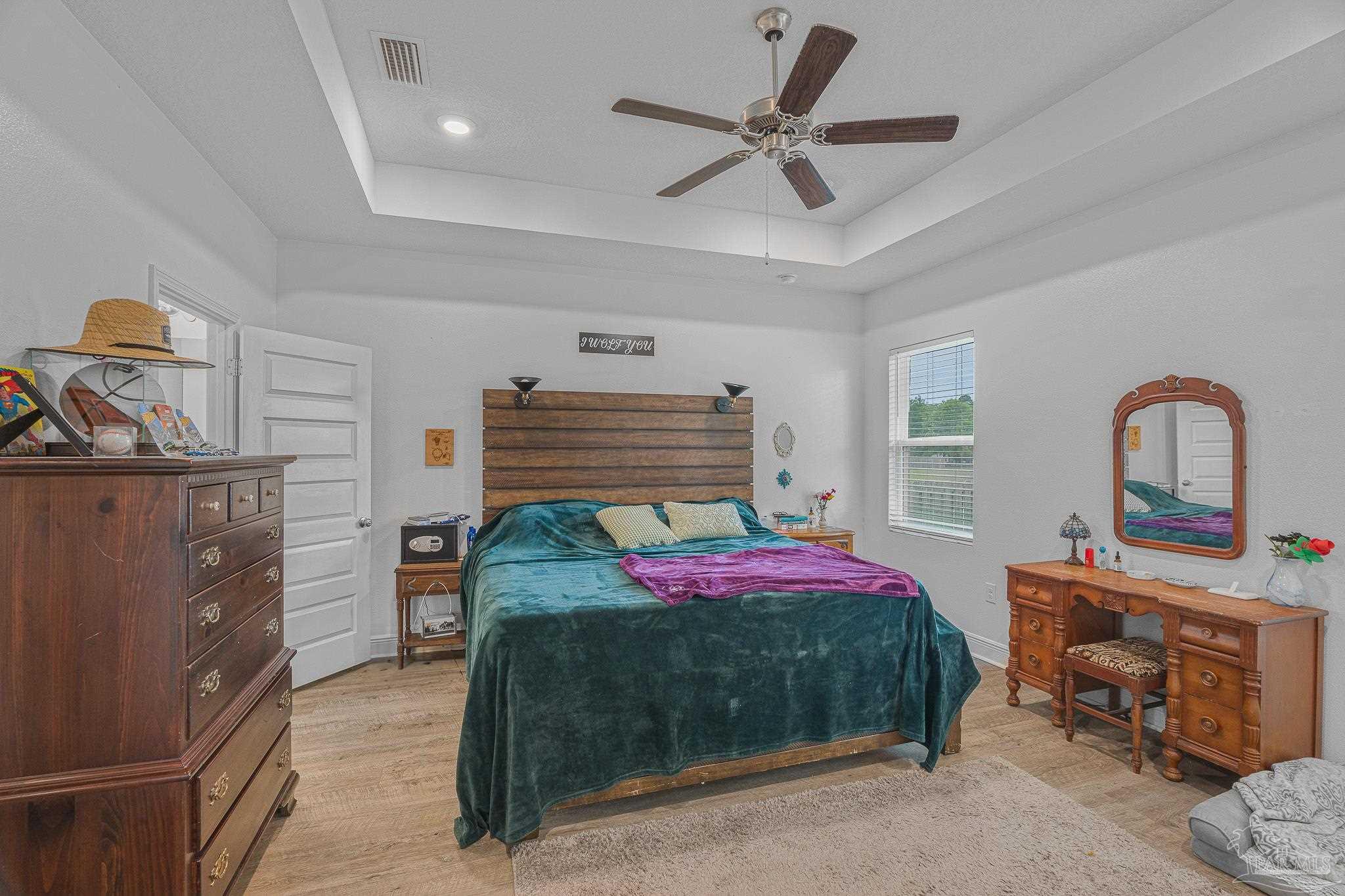 355 Cayden Way Cantonment, FL 32533 - Photo 31 of 61 a bedroom with a bed and a dresser