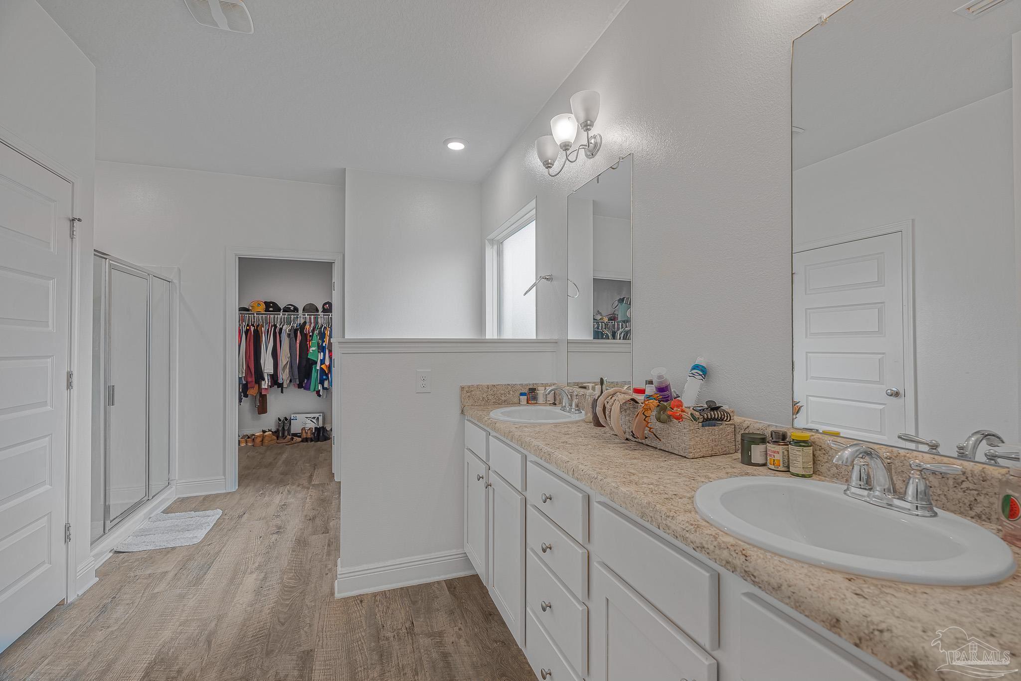 355 Cayden Way Cantonment, FL 32533 - Photo 34 of 61 a bathroom with a sink double vanity granite and a mirror