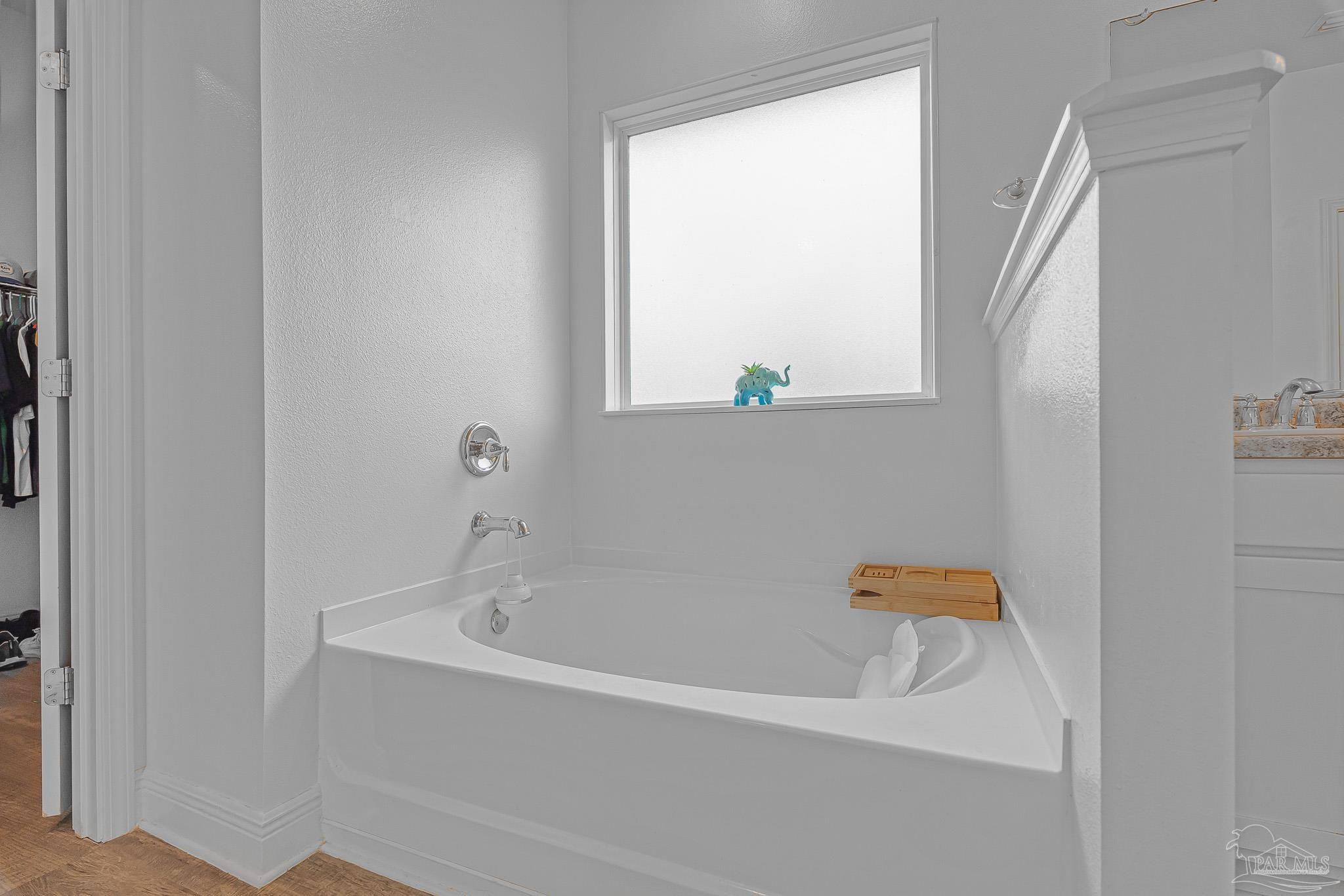 355 Cayden Way Cantonment, FL 32533 - Photo 39 of 61 a white bath tub sitting next to a window