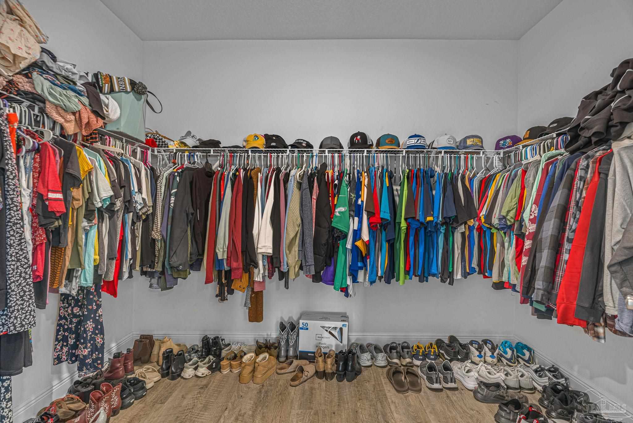 355 Cayden Way Cantonment, FL 32533 - Photo 41 of 61 a view of walk in closet with clothes