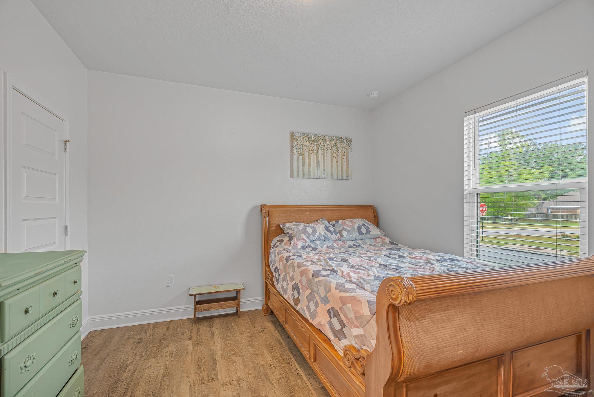 355 Cayden Way Cantonment, FL 32533 - Photo 45 of 61 a bedroom with a bed and a window