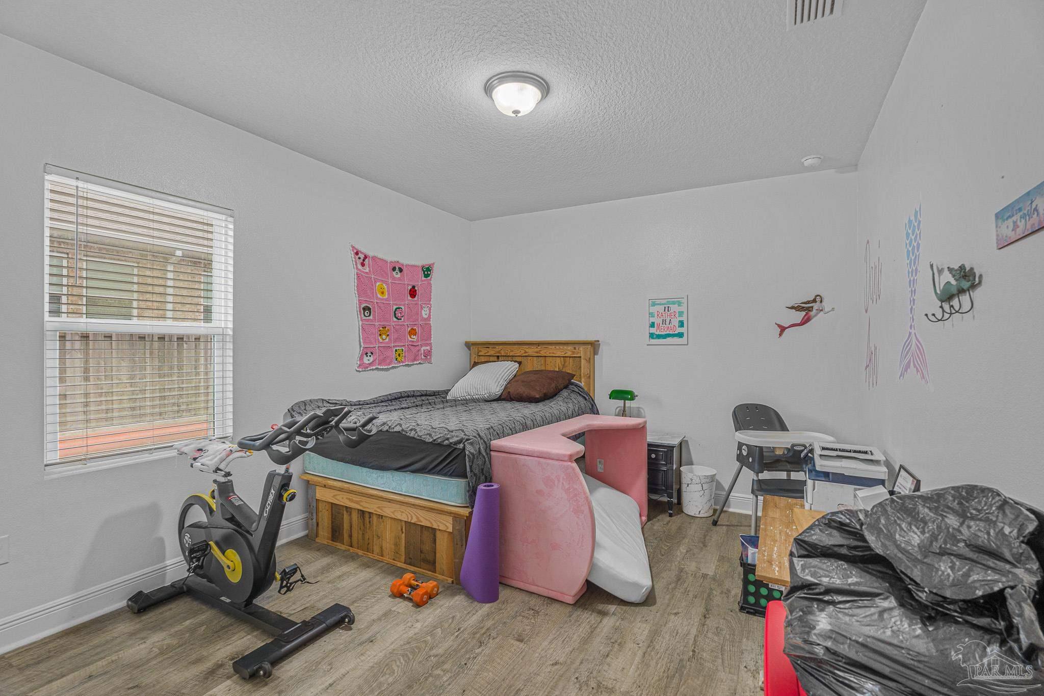 355 Cayden Way Cantonment, FL 32533 - Photo 47 of 61 a bedroom with bed and a window