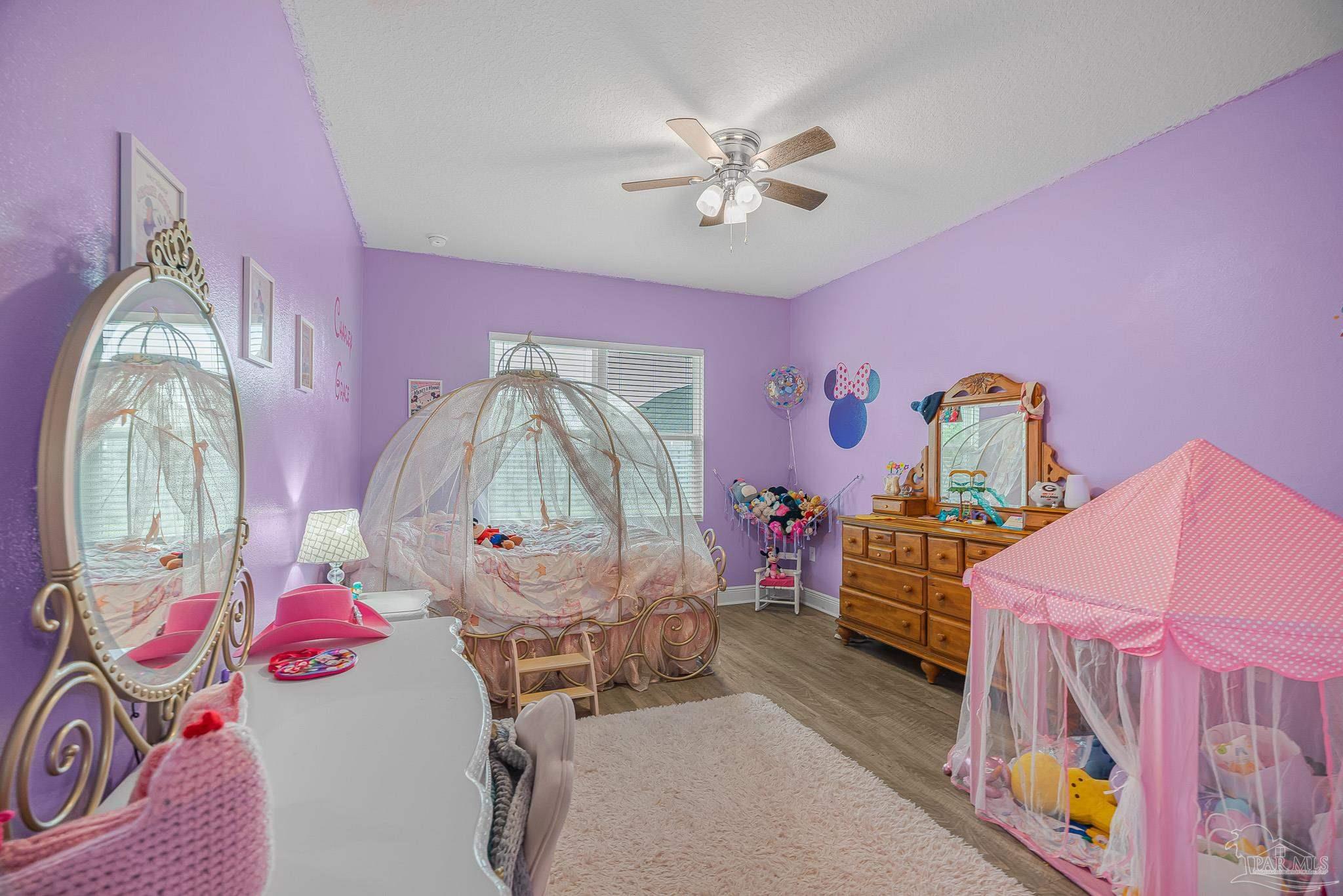 355 Cayden Way Cantonment, FL 32533 - Photo 52 of 61 a bedroom with furniture and a mirror