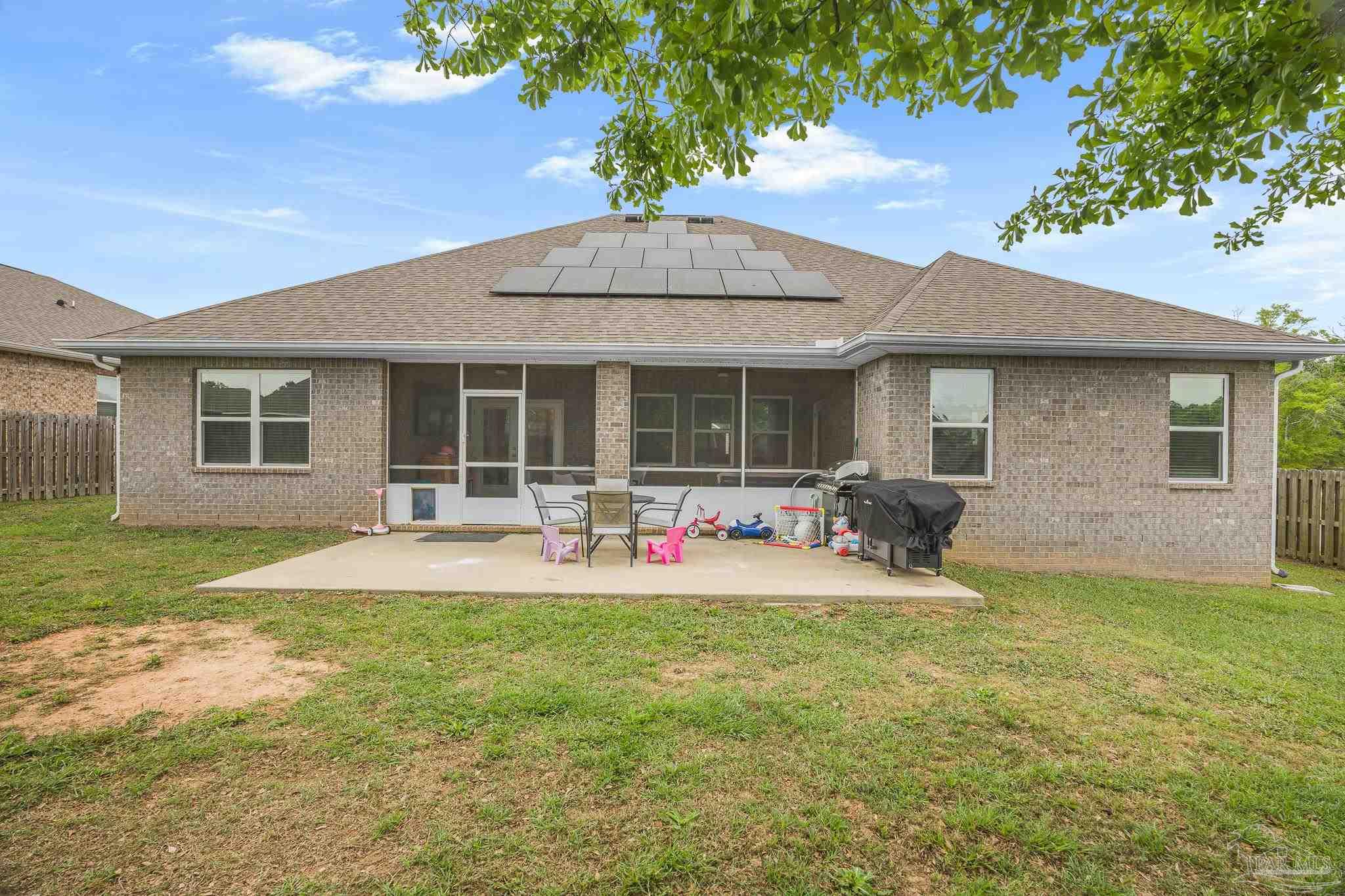 355 Cayden Way Cantonment, FL 32533 - Photo 55 of 61 a view of a house with backyard porch and sitting area