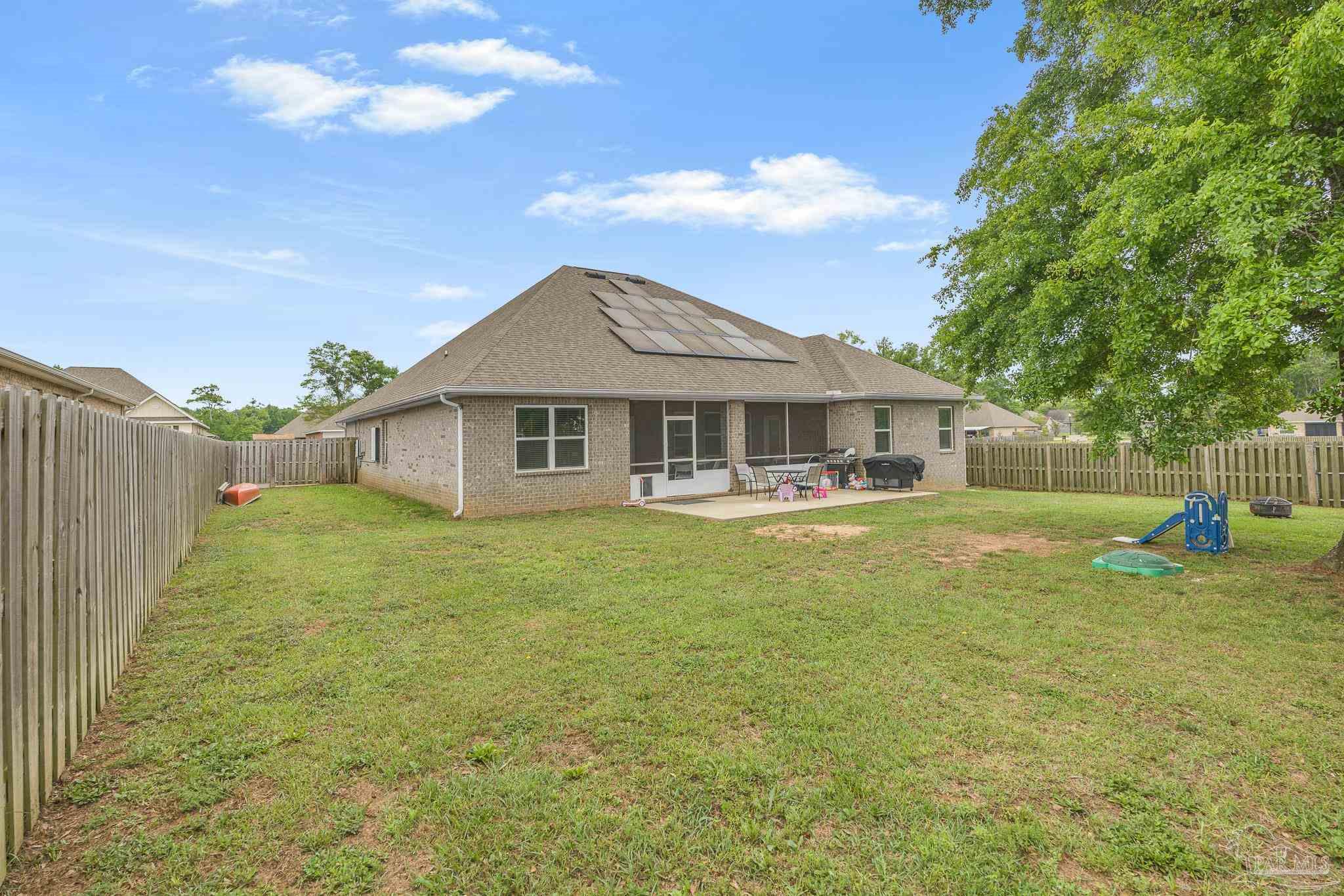 355 Cayden Way Cantonment, FL 32533 - Photo 58 of 61 a front view of a house with a garden