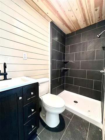 a bathroom with a toilet and a sink