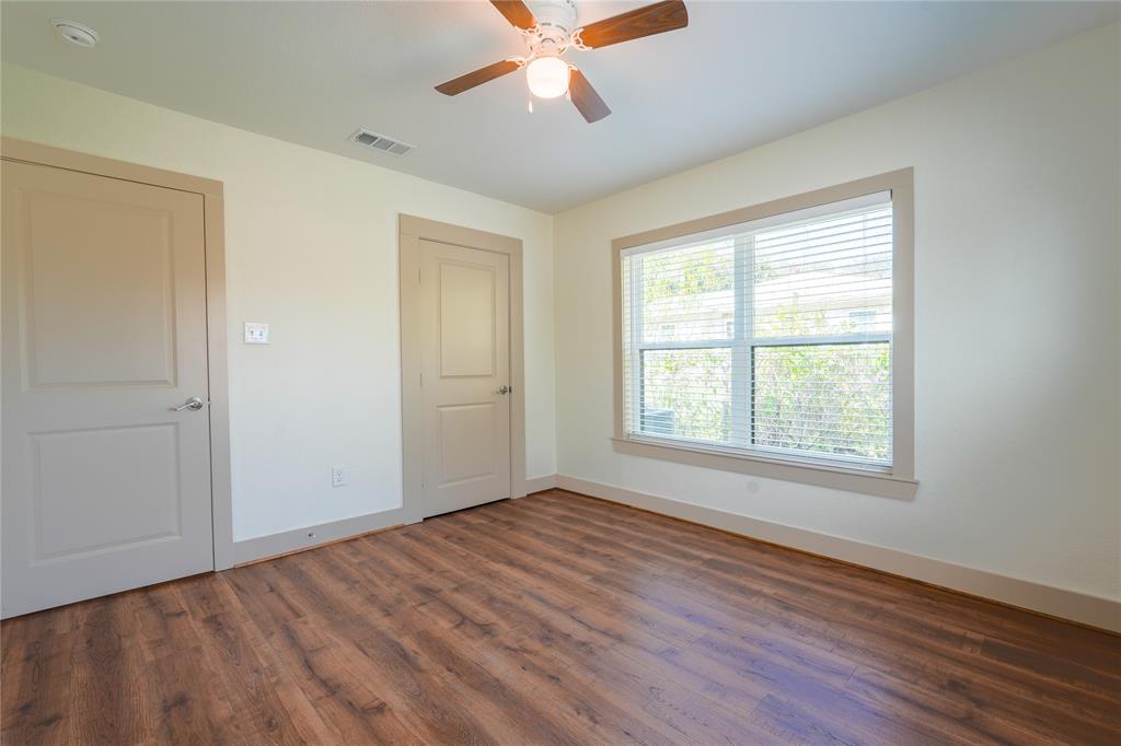 2701 McKenzie Avenue Waco, TX 76708 - Photo 19 of 19 a view of an empty room with wooden floor and a window