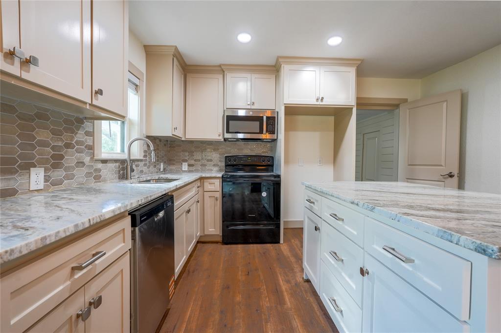 2701 McKenzie Avenue Waco, TX 76708 - Photo 9 of 19 a kitchen with stainless steel appliances granite countertop refrigerator and stove