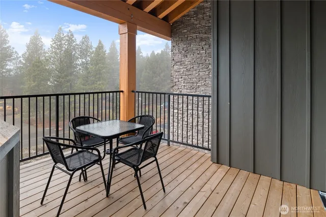 a view of balcony with furniture and wooden floor