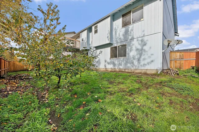 an aerial view of a house with a yard