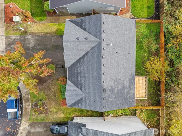 an aerial view of a house with a ocean view