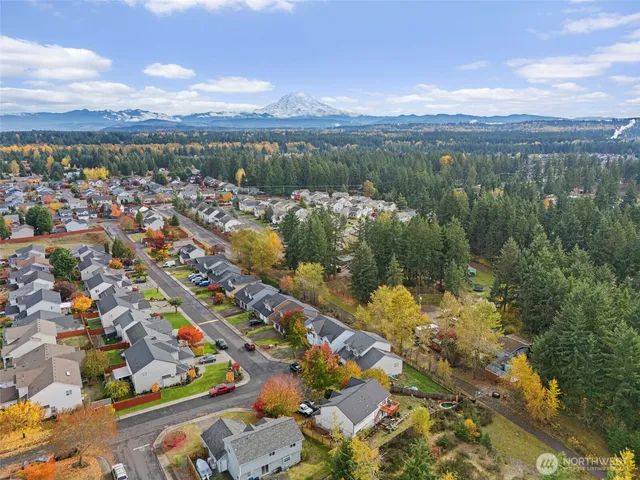 a sign that is sitting in front of flowers
