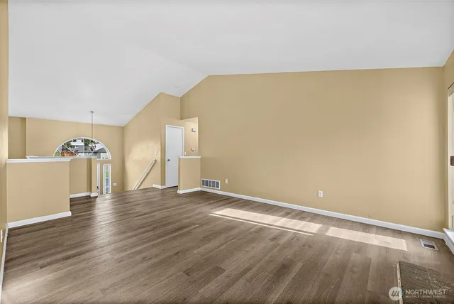 a view of a kitchen with a sink and dishwasher cabinets
