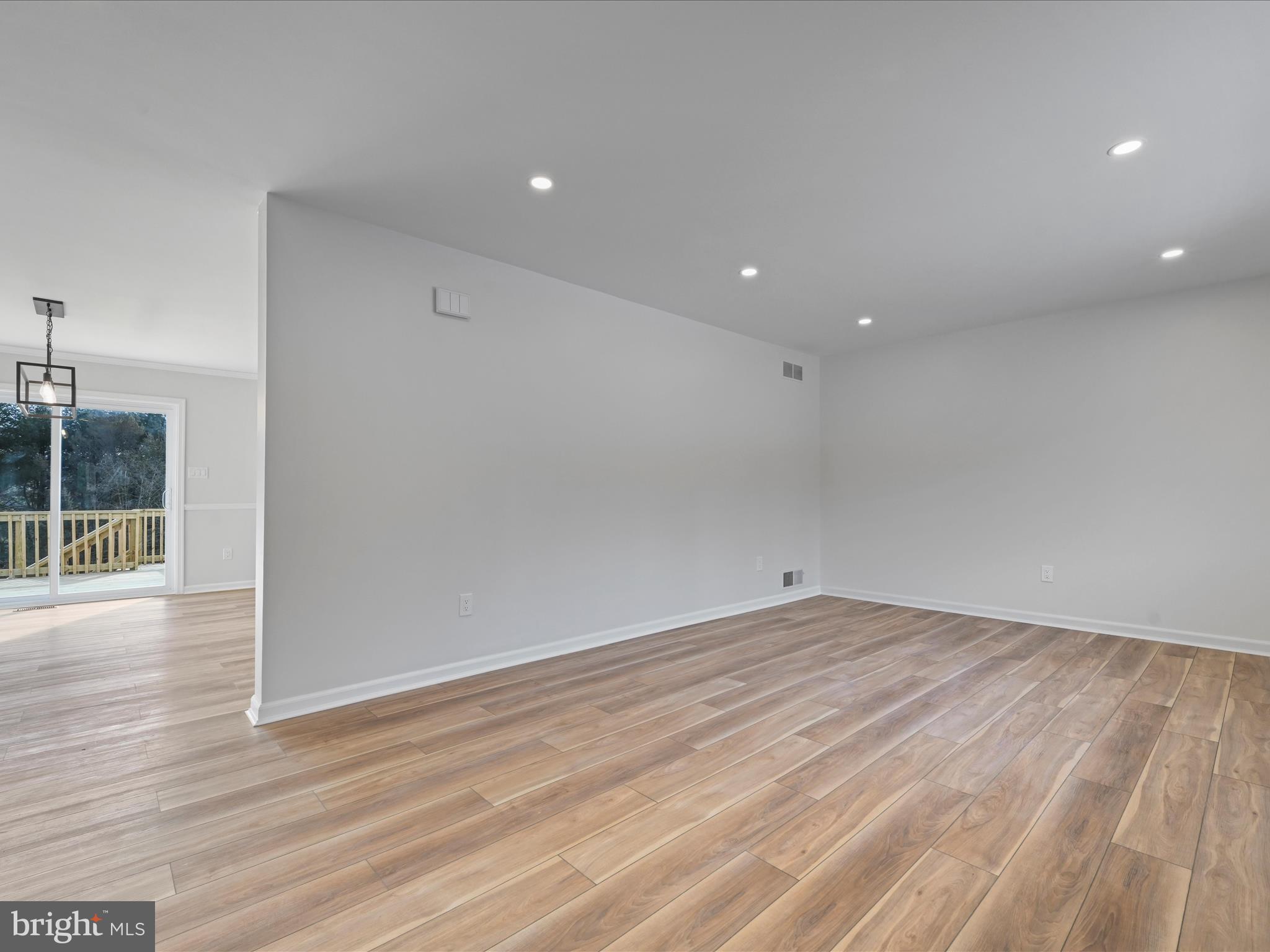 213 Miller Road Reading, PA 19608 - Photo 5 of 38 an empty room with wooden floor and windows