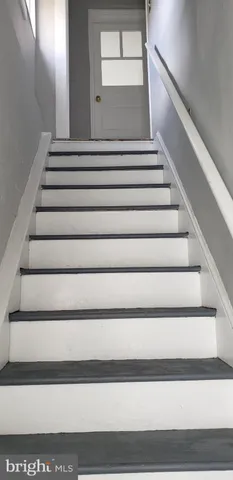 a kitchen with a refrigerator and window