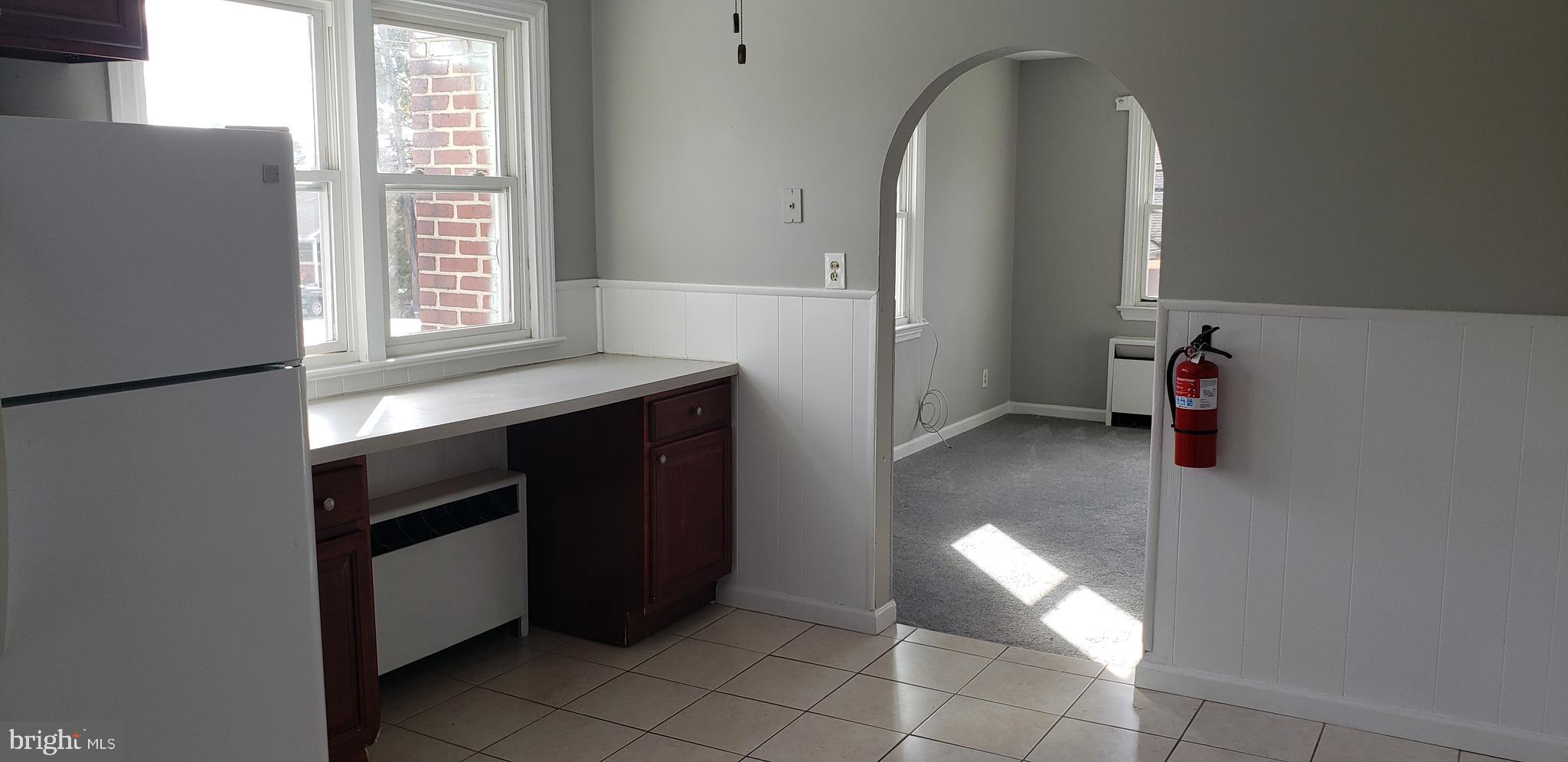 621 North Forklanding Road, Unit B Maple Shade, NJ 08052 - Photo 4 of 12 a kitchen with a refrigerator and window