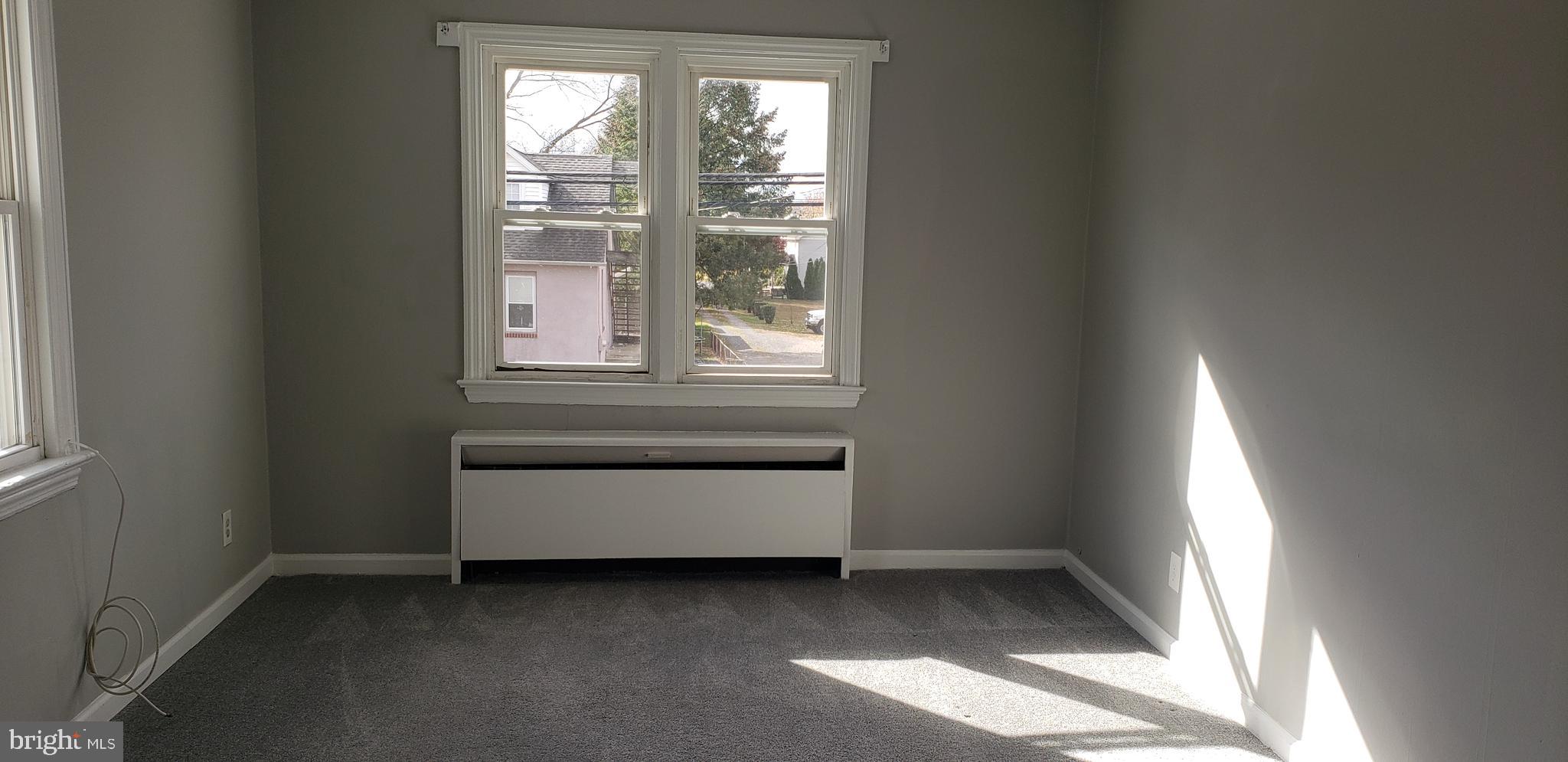 621 North Forklanding Road, Unit B Maple Shade, NJ 08052 - Photo 6 of 12 an empty room with a window