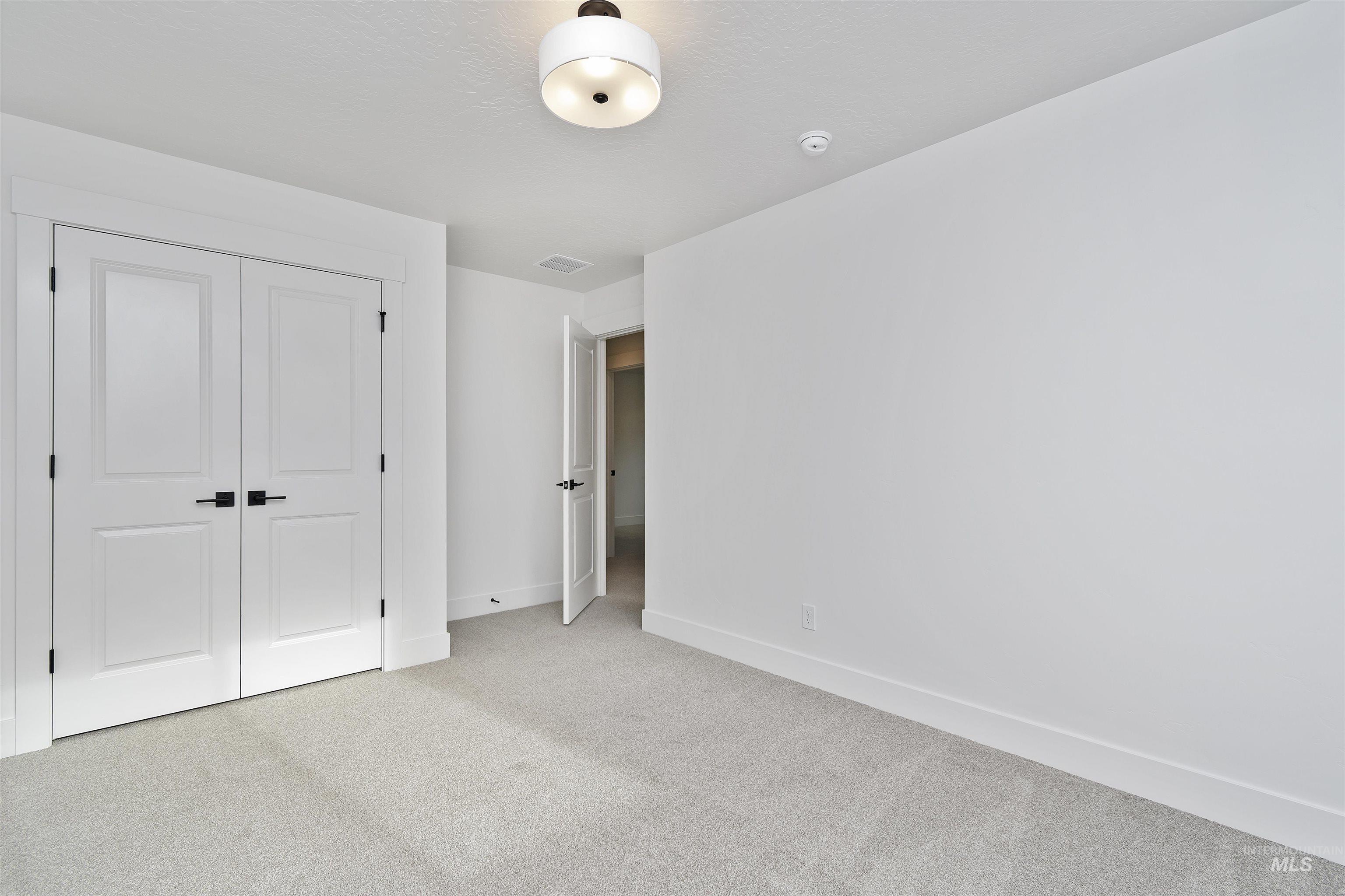 764 South Calhoun Lane Star, ID 83669 - Photo 32 of 48 Unfurnished bedroom featuring carpet flooring and a closet