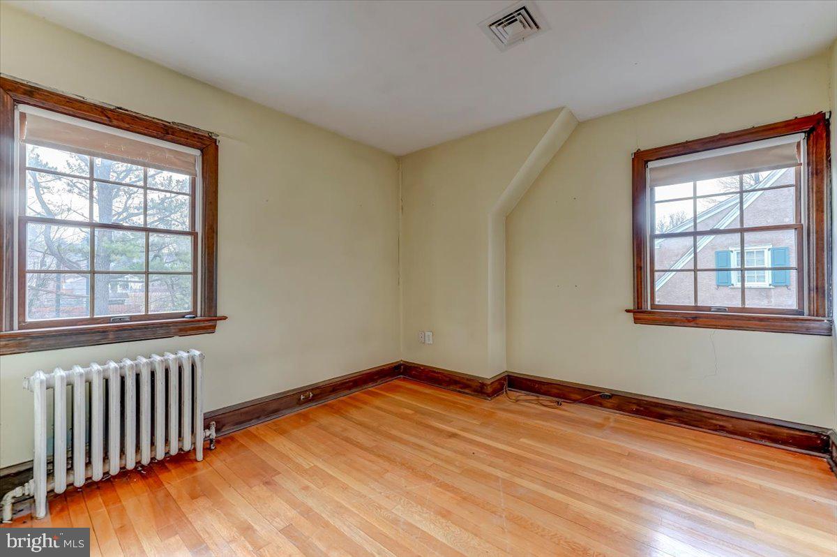 327 North Rolling Road Springfield, PA 19064 - Photo 24 of 34 a view of empty room with wooden floor and fan