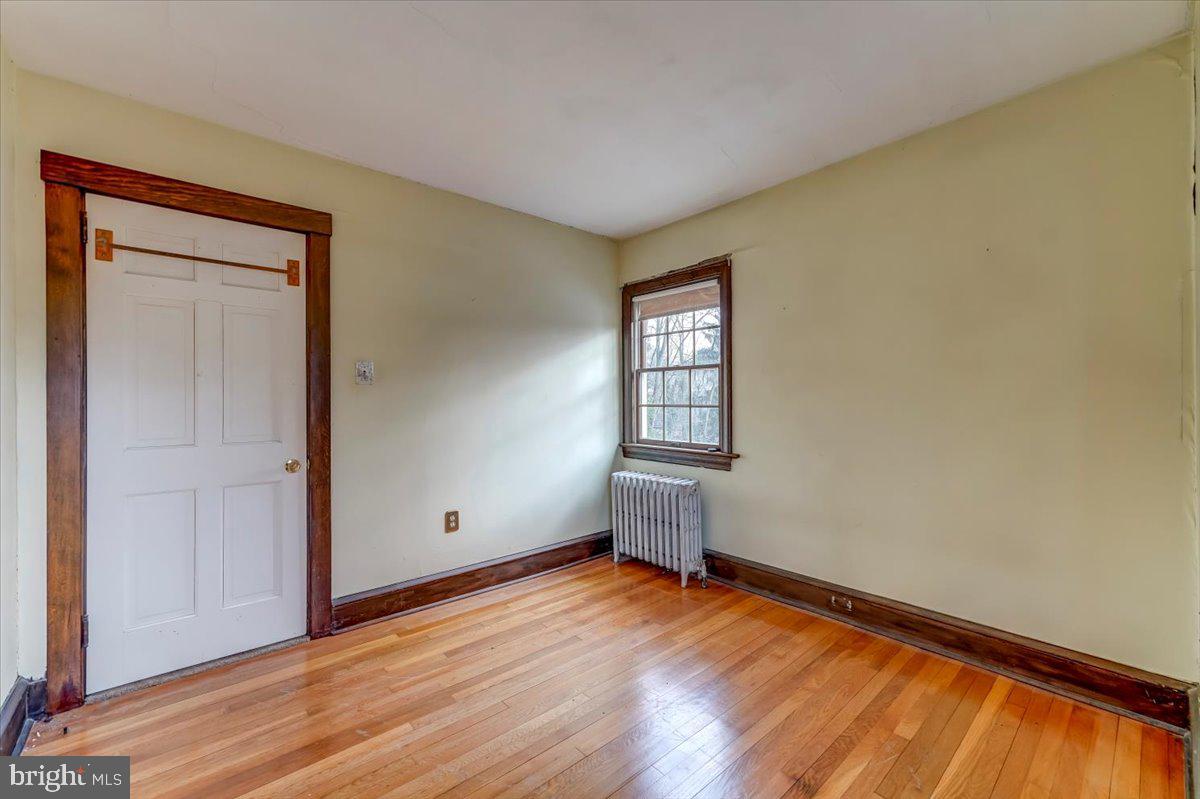 327 North Rolling Road Springfield, PA 19064 - Photo 25 of 34 a view of empty room with wooden floor and fan
