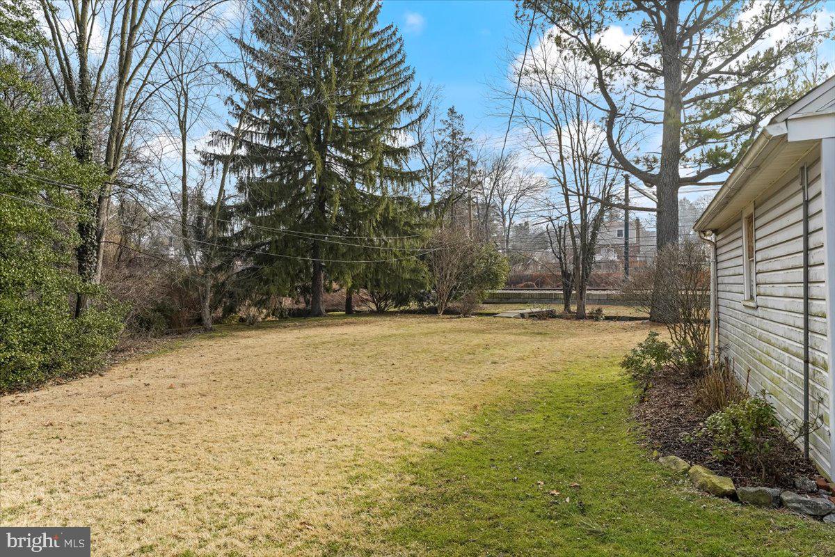 327 North Rolling Road Springfield, PA 19064 - Photo 29 of 34 a view of swimming pool with large trees