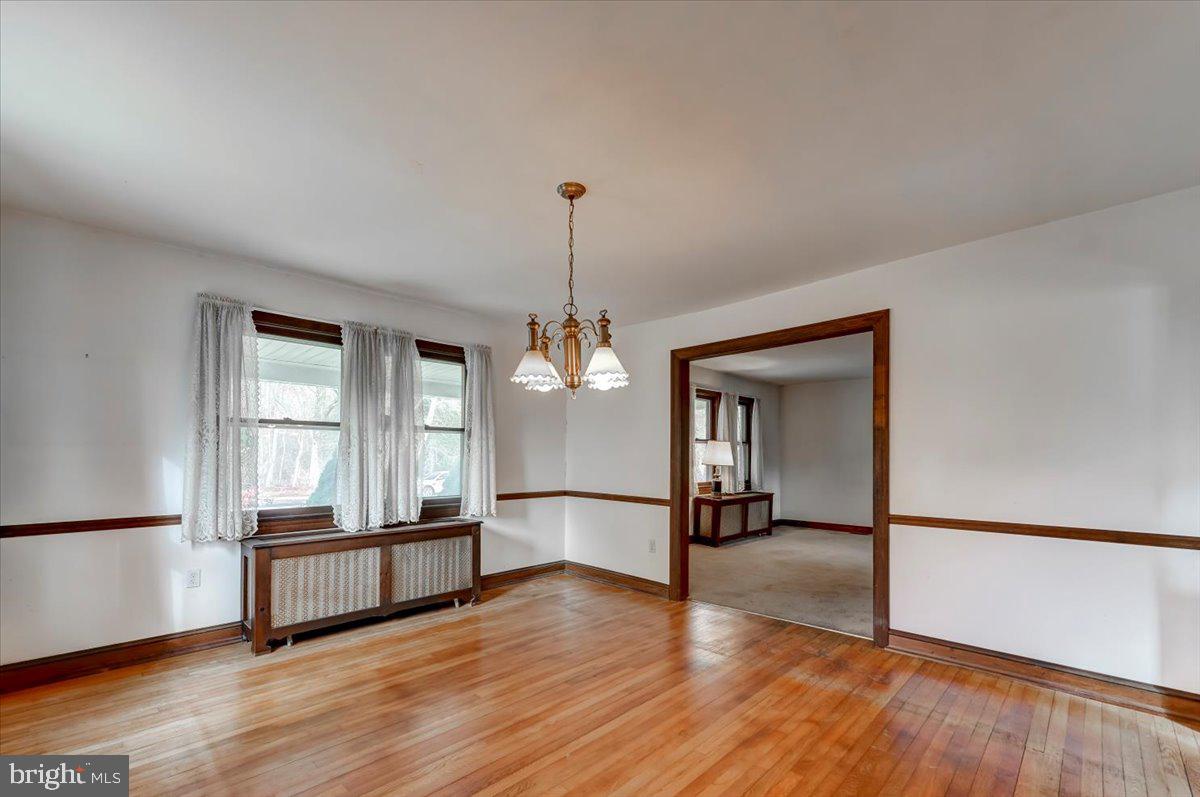 327 North Rolling Road Springfield, PA 19064 - Photo 10 of 34 a view of a room with wooden floor and a window