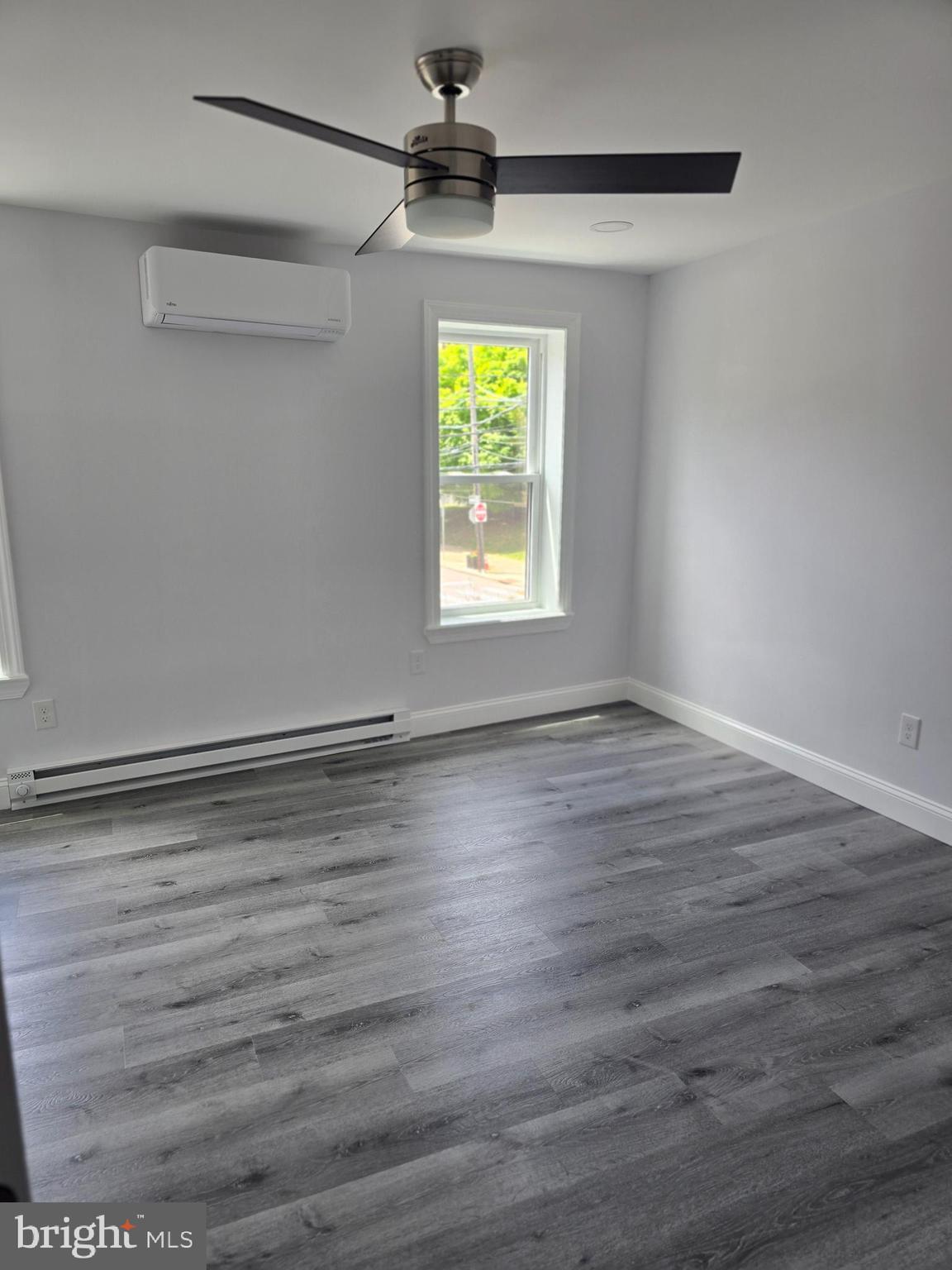 5925 Ridge Avenue, Unit 5 Philadelphia, PA 19128 - Photo 31 of 31 a view of room with window and wooden floor