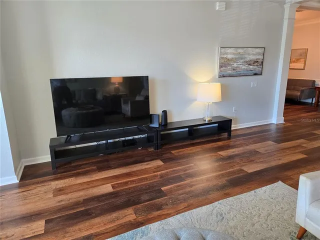 a living room with couch and a flat screen tv