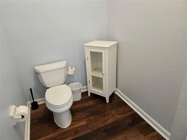 a bathroom with a toilet and a sink
