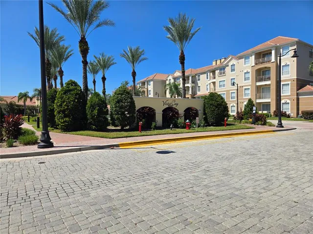 a view of building with palm trees