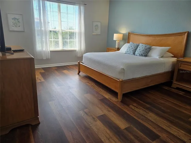 a bedroom with a bed and window