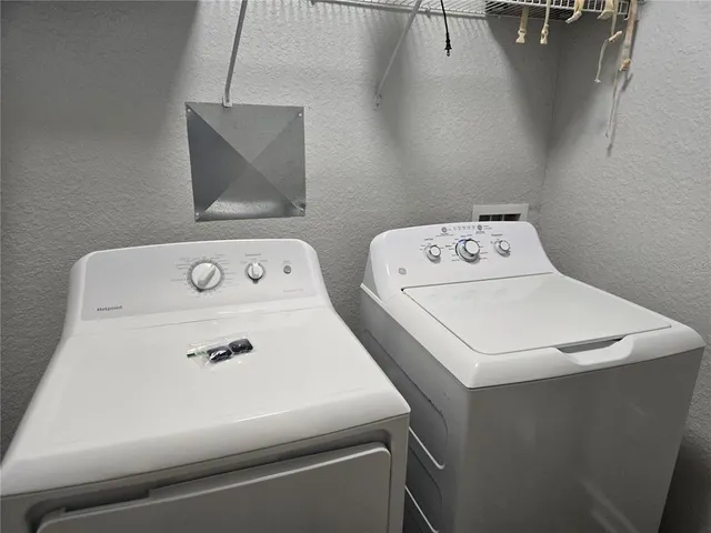 a utility room with dryer and washer