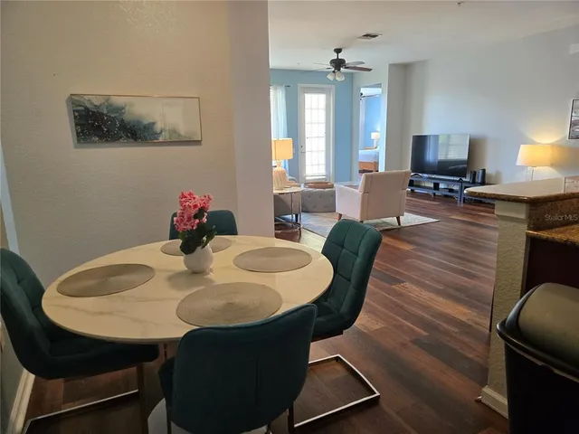 a dining room with furniture and window