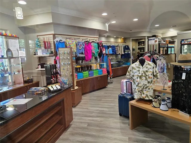 a living room filled with furniture and a table