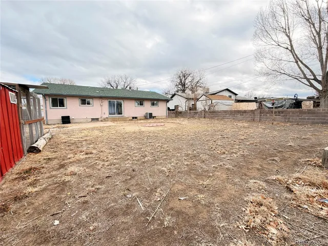 a view of a house with a snow in the background
