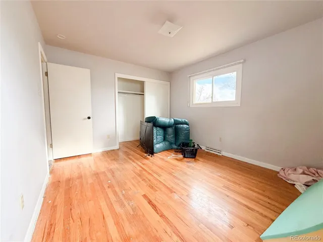 a room with a bed and a chair