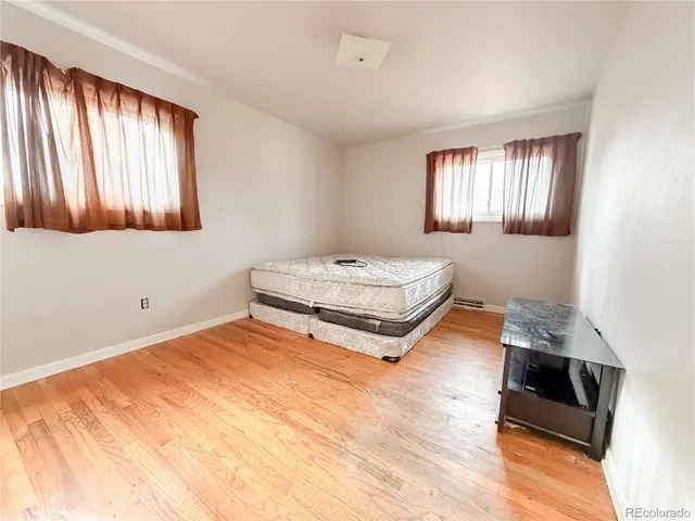 a room with a bed and a window