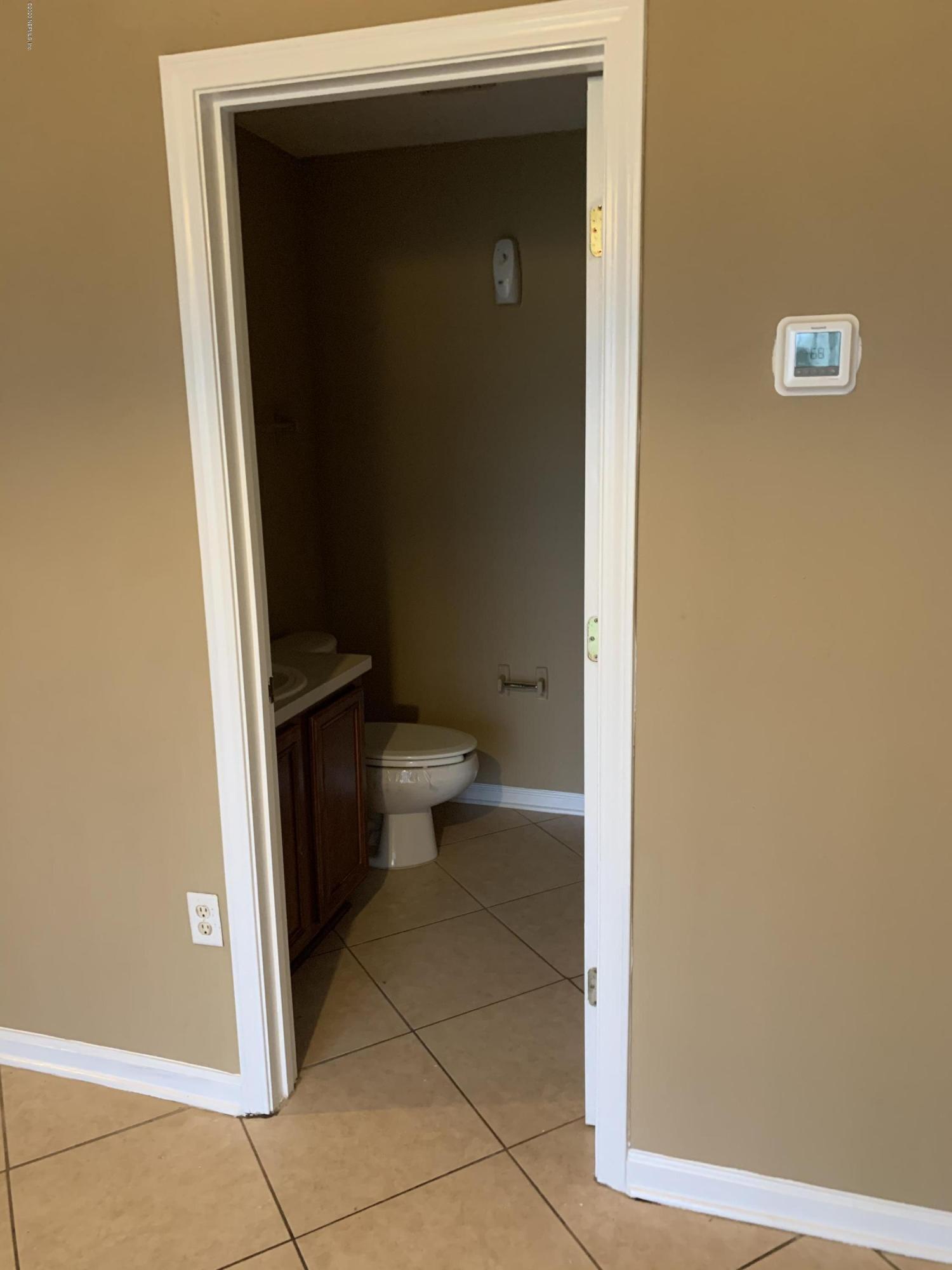 7140 Rampart Ridge Circle West Jacksonville, FL 32244 - Photo 13 of 13 a bathroom with a toilet and a shower