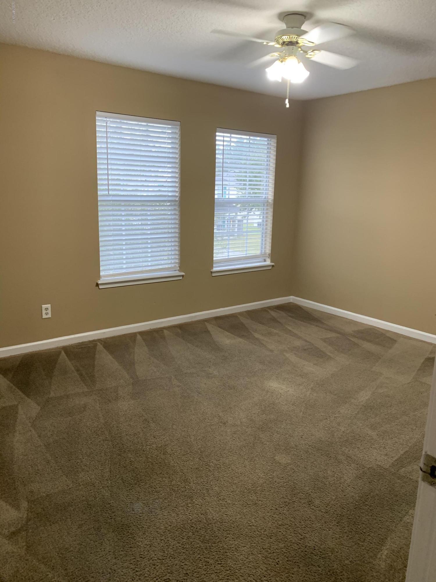 7140 Rampart Ridge Circle West Jacksonville, FL 32244 - Photo 8 of 13 a view of an empty room with a window