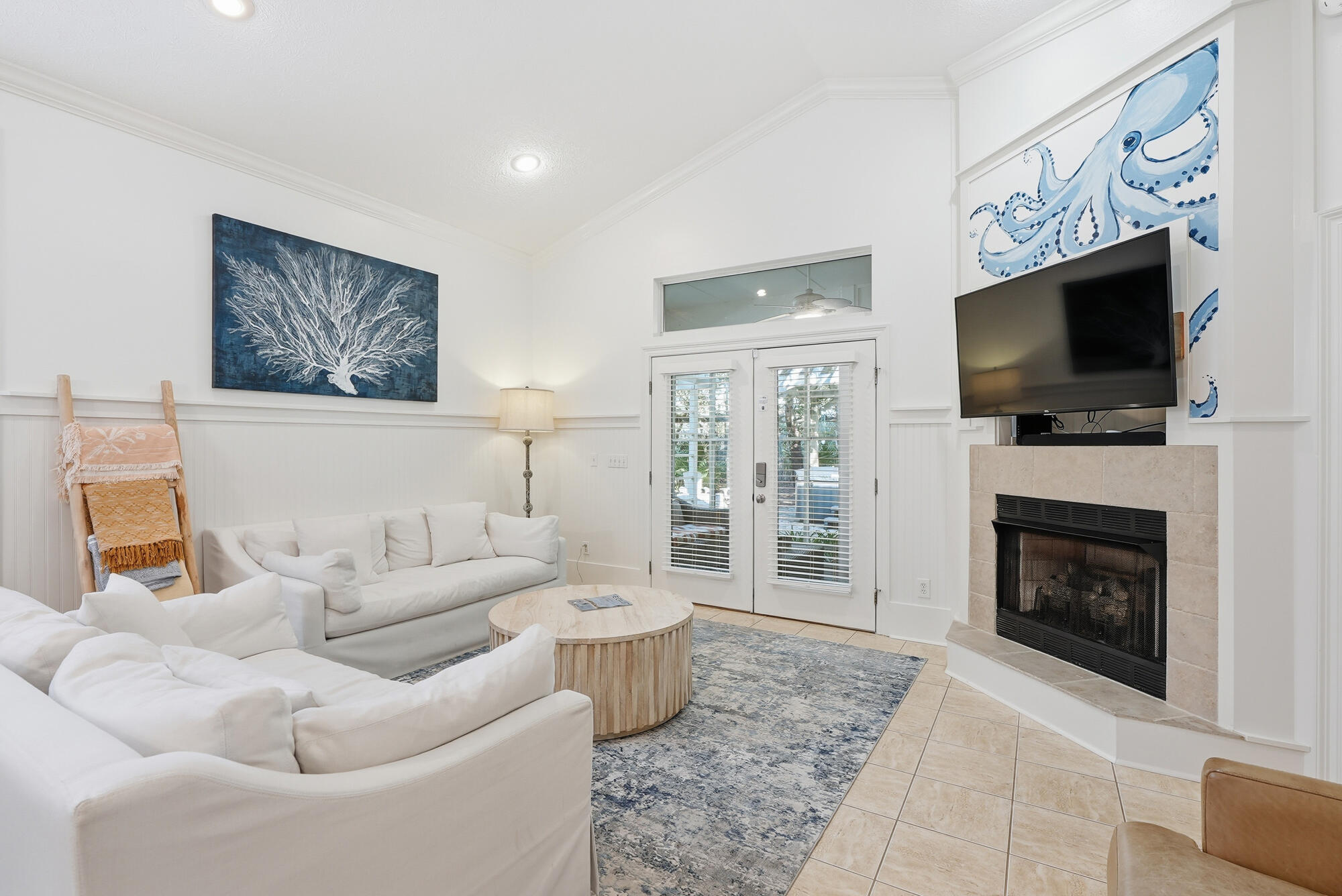 128 Seabreeze Boulevard Inlet Beach, FL 32461 - Photo 12 of 54 a living room with furniture a flat screen tv and a fireplace