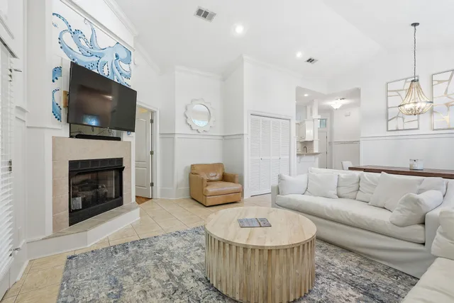 a large white kitchen with lots of counter top space wooden floor and appliances