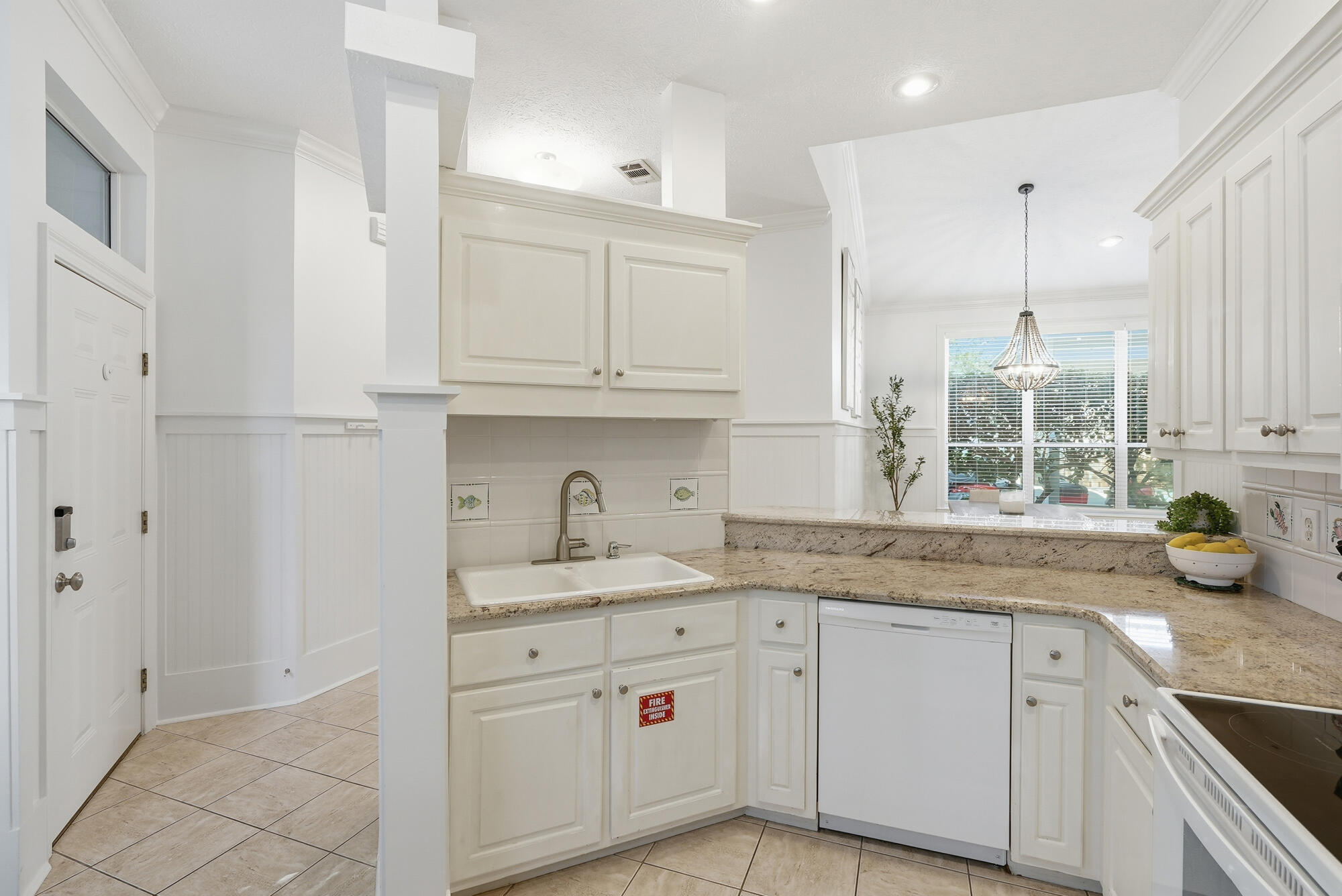 128 Seabreeze Boulevard Inlet Beach, FL 32461 - Photo 19 of 54 a kitchen with stainless steel appliances granite countertop a sink a stove and cabinets