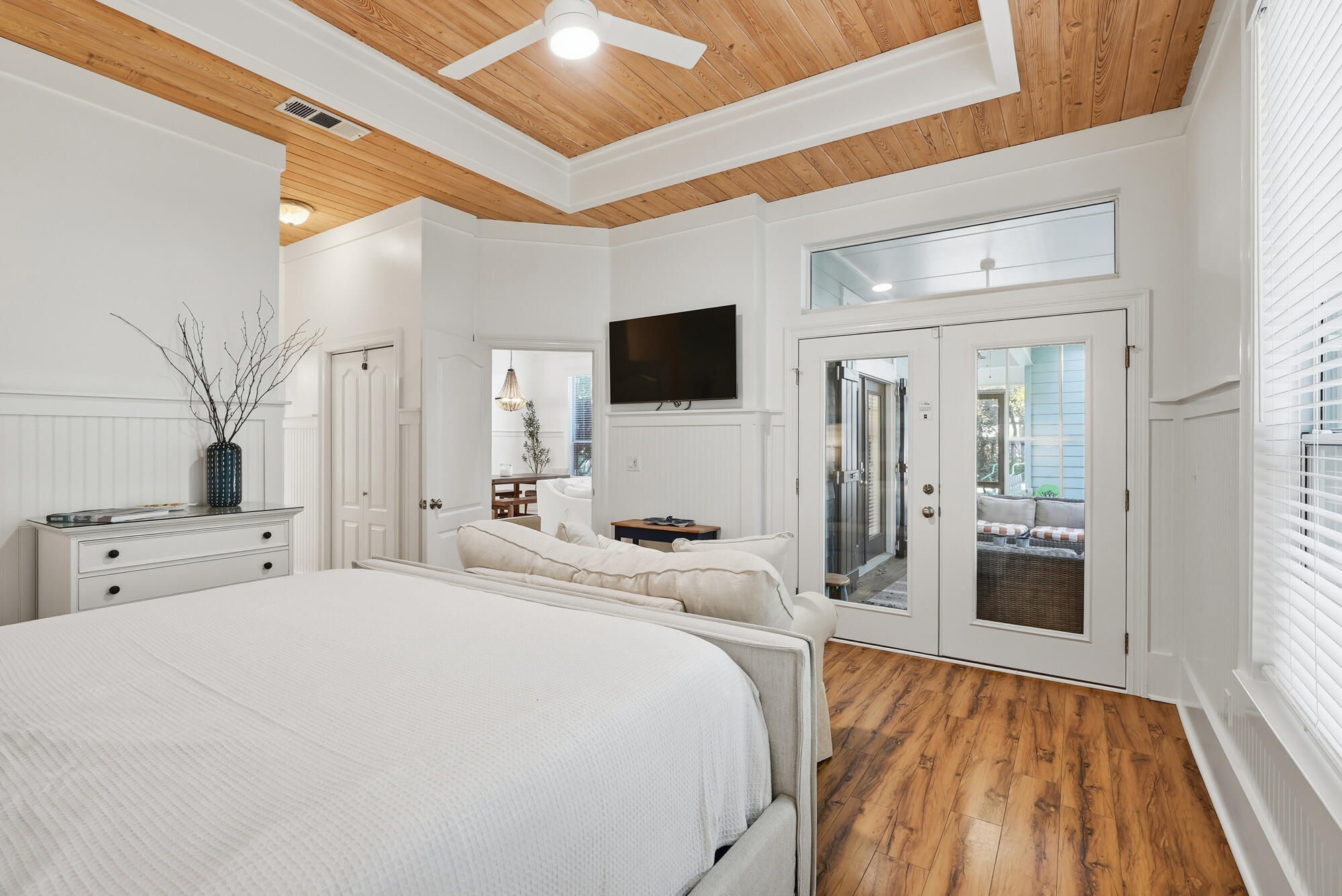 128 Seabreeze Boulevard Inlet Beach, FL 32461 - Photo 23 of 54 a large bedroom with a bed and a flat tv screen on wall