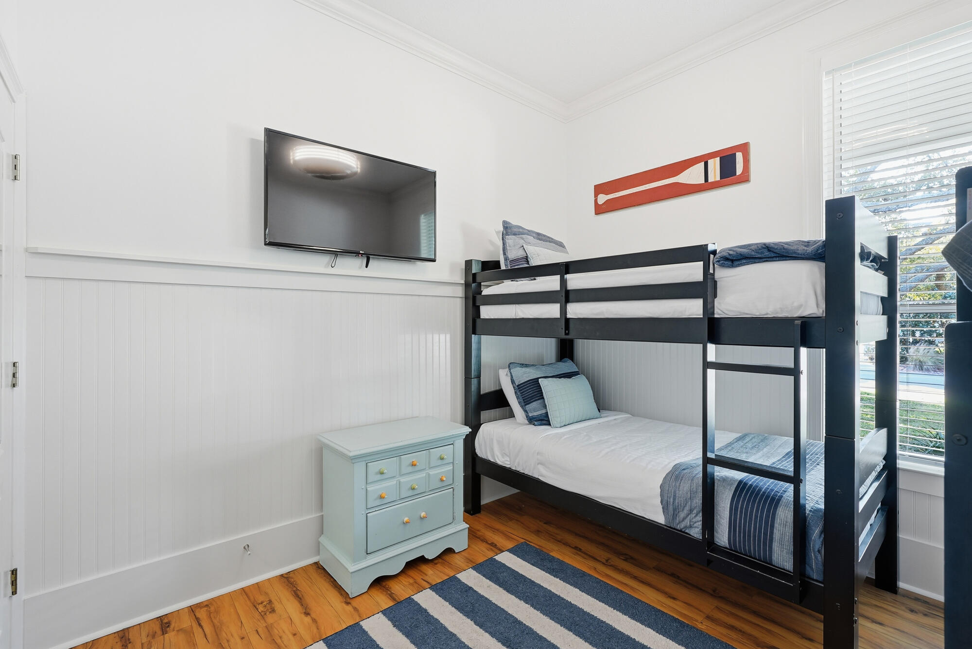 128 Seabreeze Boulevard Inlet Beach, FL 32461 - Photo 29 of 54 a bedroom with furniture and a flat screen tv